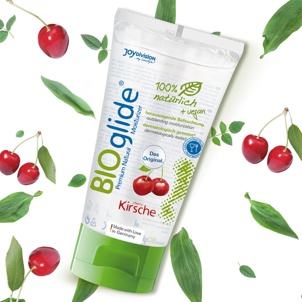 BIOglide lubricant packaging with cherries and leaves on a white background