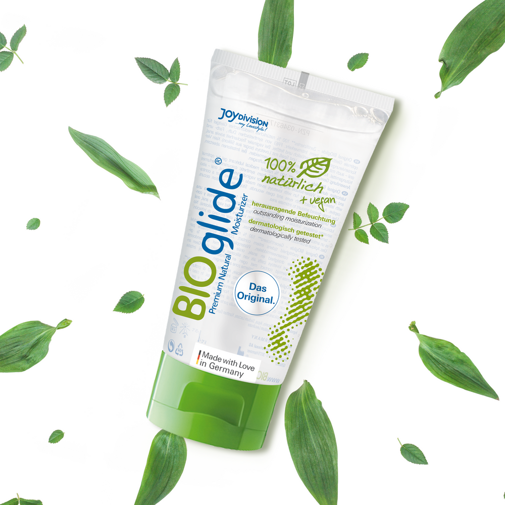 BIoglide lubricant packaging with green leaves on a white background