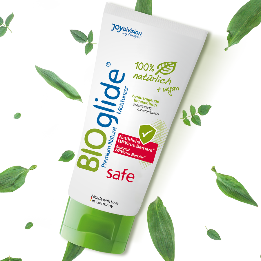 Bio glide lubricant packaging with green leaves on a white background